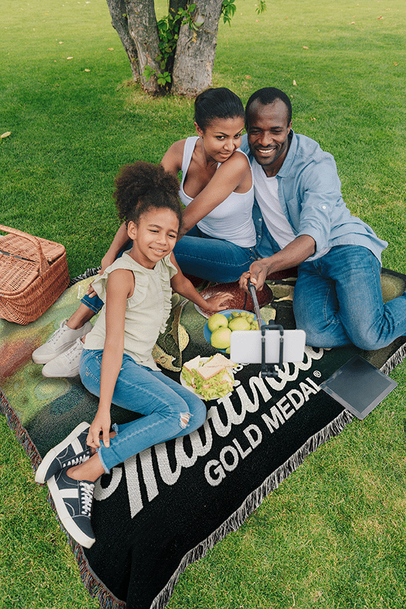 woman sitting on couch with blanket