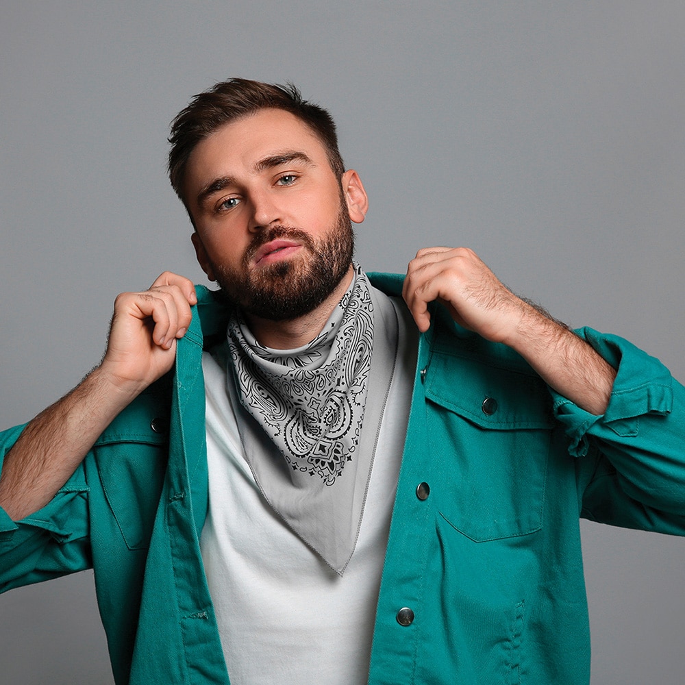 man wearing a paisley bandanna around his neck