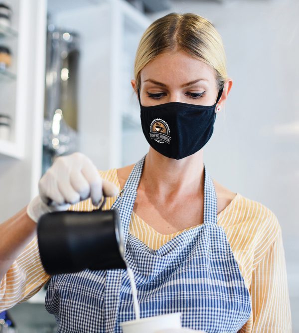 Barista pouring coffee with customizable mask logo
